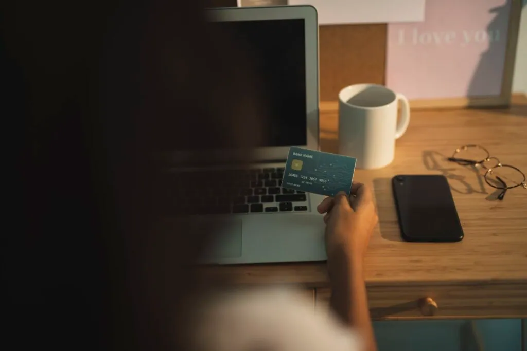 Person making online payment with credit card