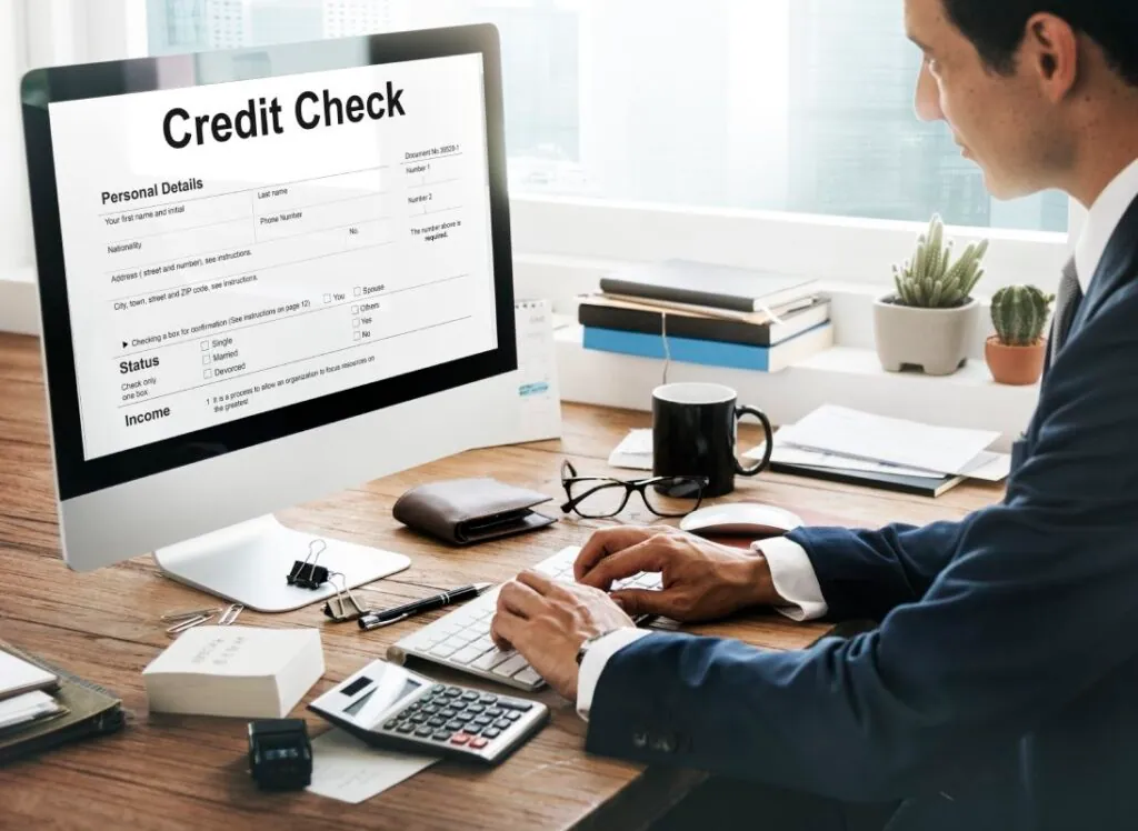 Man in suit checking credit report online