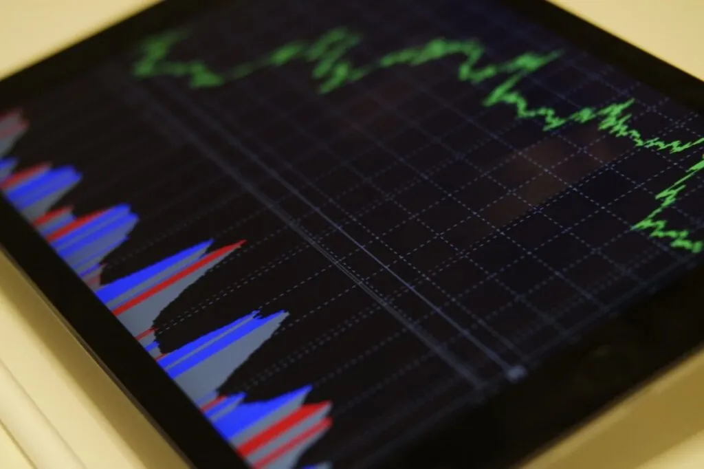Tablet screen showing green and blue graph lines
