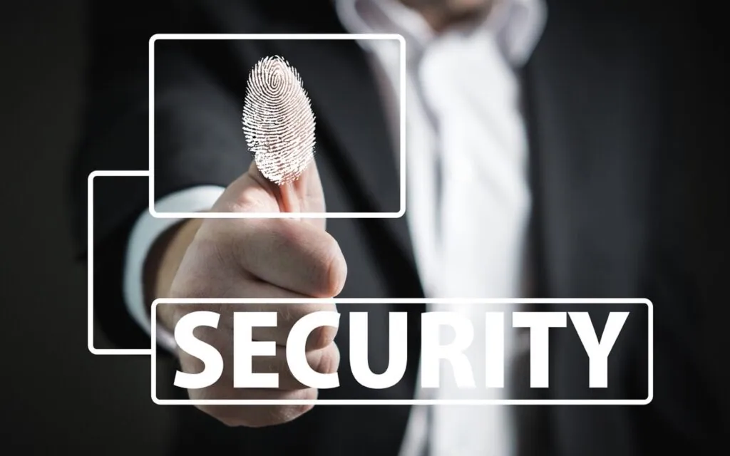 Person scanning fingerprint for security access