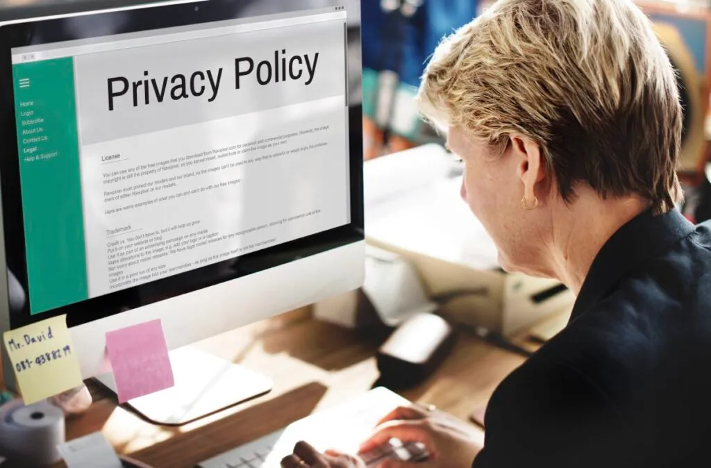 Person reading a privacy policy on a computer screen