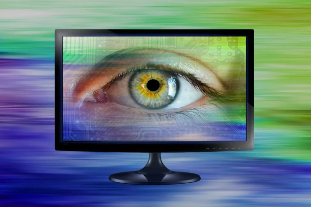 A large eye displayed on a monitor
