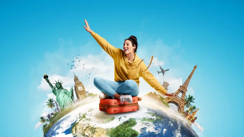 Woman sitting on suitcase with world landmarks
