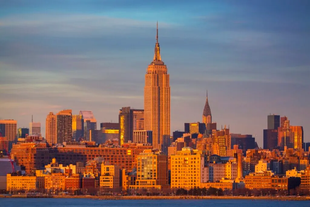 New York City skyline at sunset featuring skyscrapers
