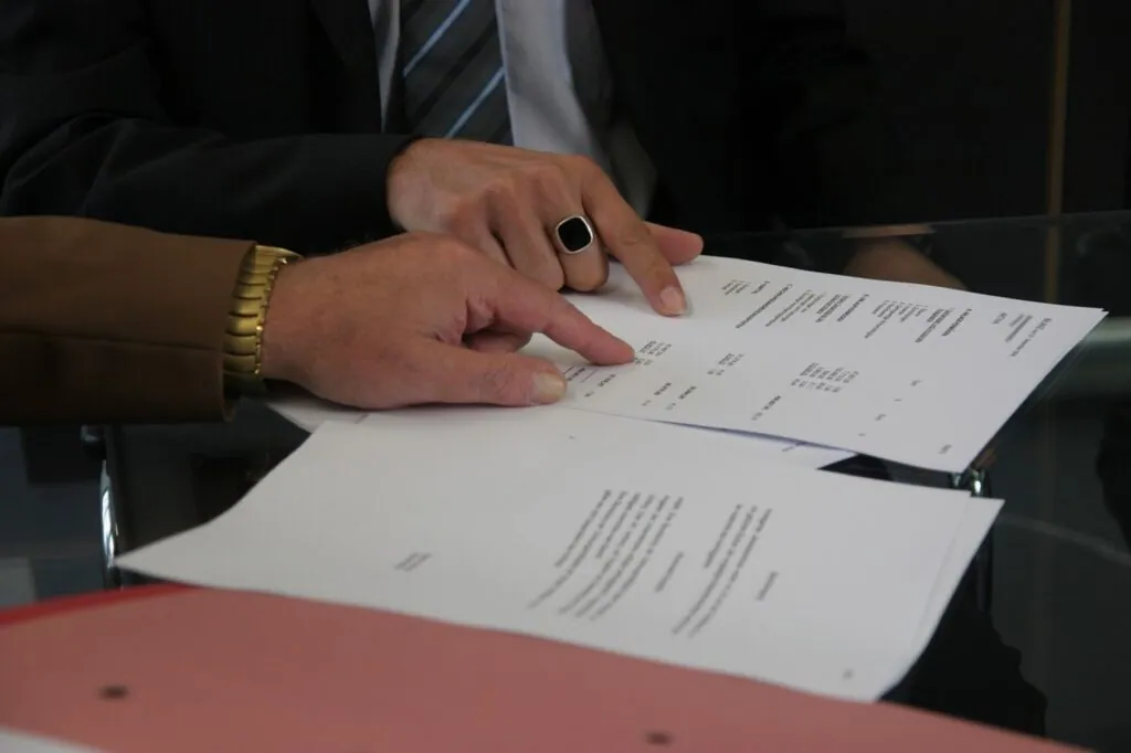 Two people reviewing documents together