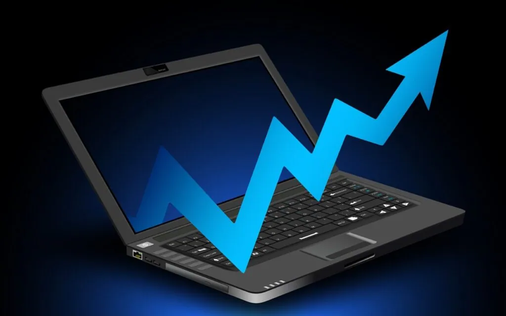 Blue upward arrow emerging from a laptop screen