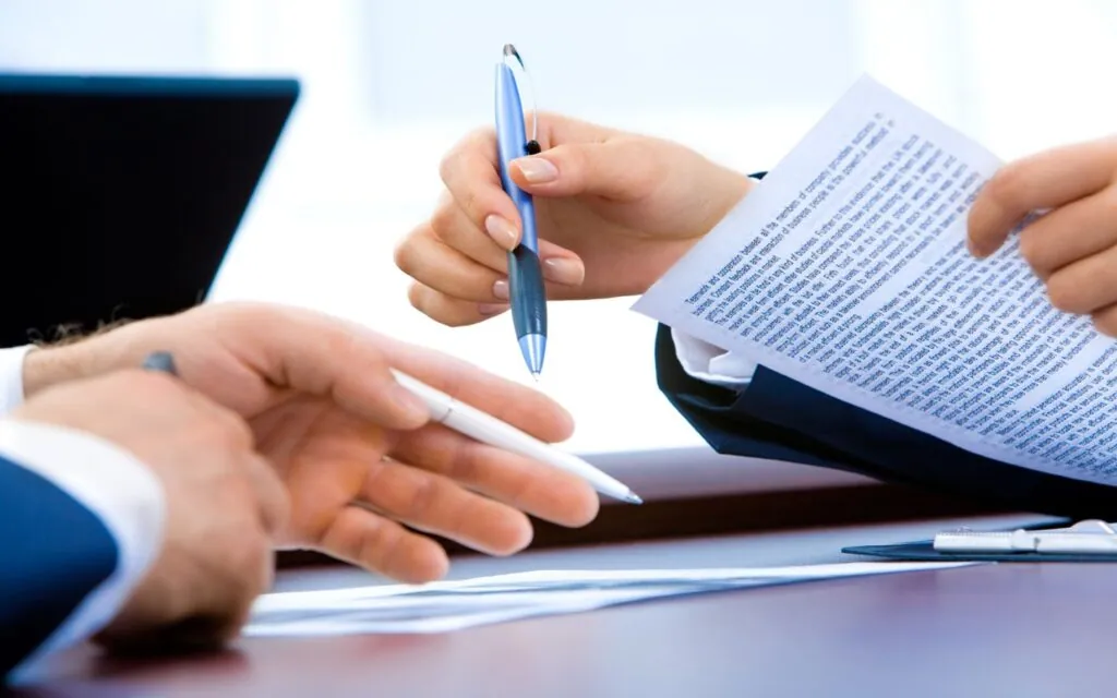 Business meeting with documents and pens