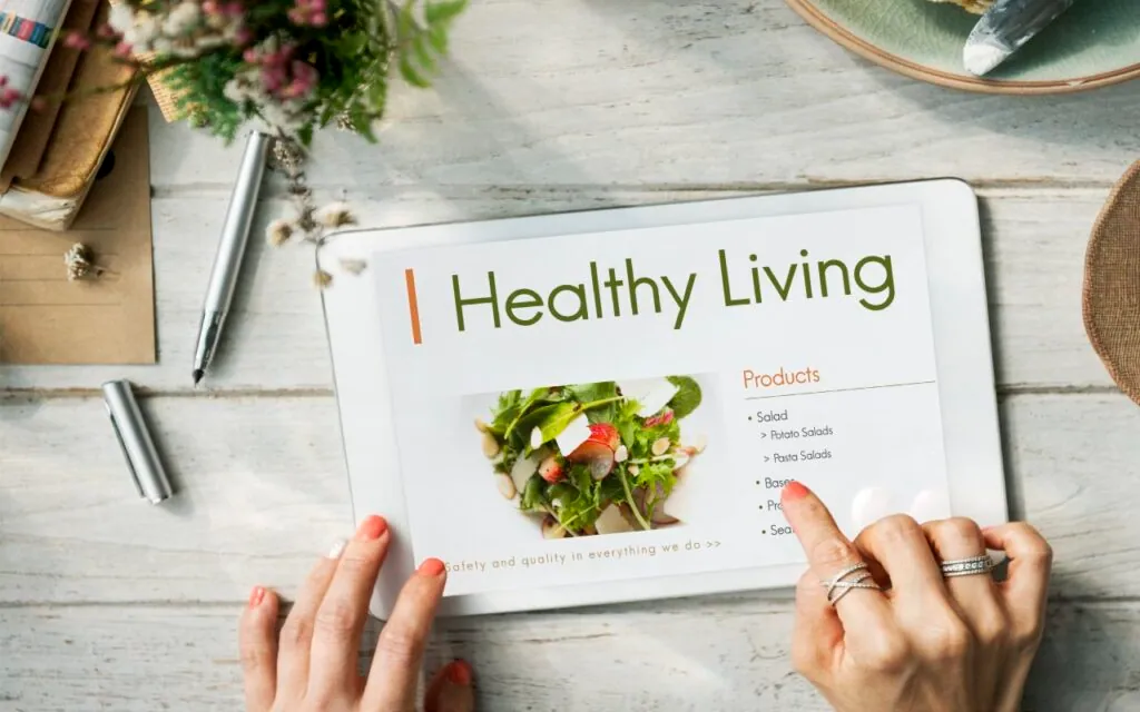 Tablet displaying healthy living menu with salads