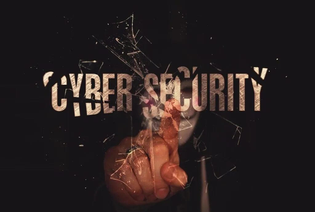 Finger touching shattered "Cyber Security" text