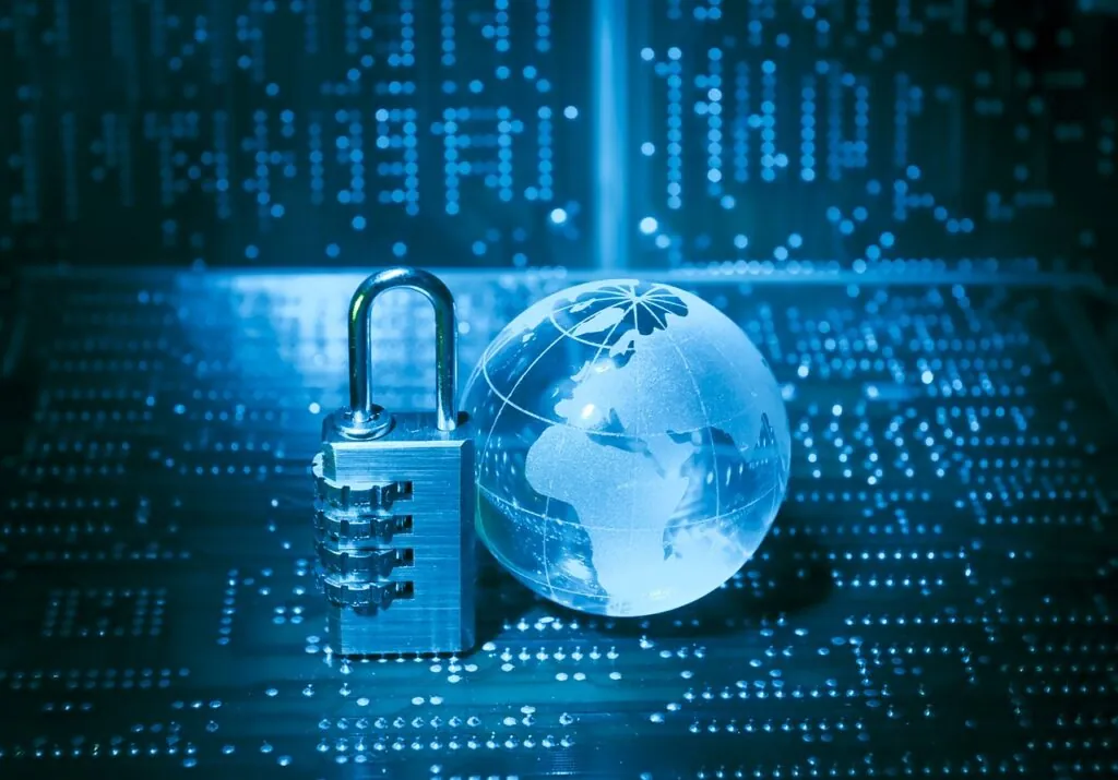 Padlock and glass globe on a digital background