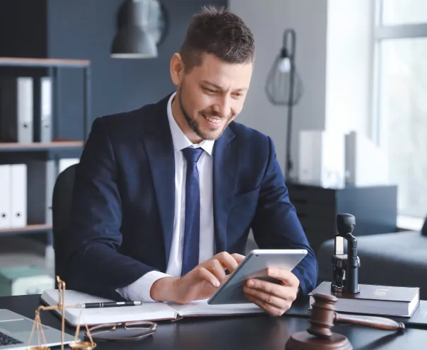 Lawyer reviewing documents on tablet